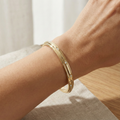 the-helios-twist-flush-set-diamond-bangle