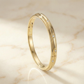 the-helios-twist-flush-set-diamond-bangle