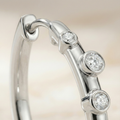 the-stella-station-hoops-scattered-bezel-diamond-earrings